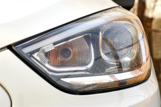 White Car Headlights. Exterior Detail Automobile Close-Up | EUROPA PRESS ep white car headlights exterior detail automobile close-up