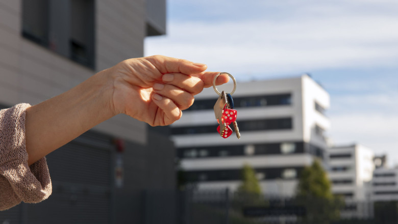 hand holding keys outdoors 