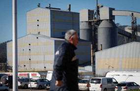 ep archivo   un hombre camina frente a la fabrica de alcoa en san cibrao lugo galicia espana