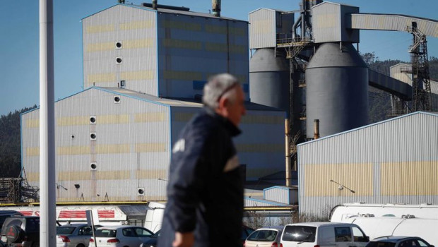 ep archivo   un hombre camina frente a la fabrica de alcoa en san cibrao lugo galicia espana