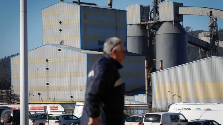 ep archivo   un hombre camina frente a la fabrica de alcoa en san cibrao lugo galicia espana