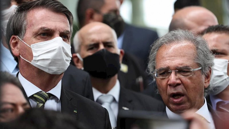 El presidente de Brasil, Jair Bolsonaro, y el ministro de Economía, Paulo Guedes. | Marcos Correa/Palacio Planalto / DPA ep el presidente de brasil jair bolsonaro y el ministro de economia paulo guedes 20200512031804