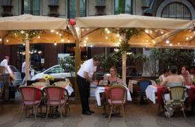 ep archivo   un camarero atiende una mesa en un bar de barcelona
