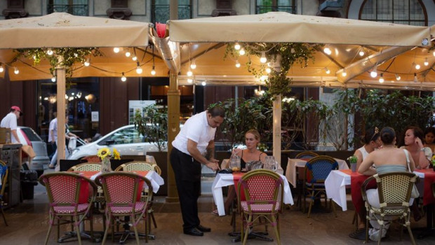 ep archivo   un camarero atiende una mesa en un bar de barcelona