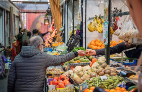 ep archivo   un hombre en un puesto del mercado de abastos realiza sus compras en sevilla andalucia