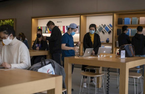 ep april 1 2020 - shanghai china staff and customers at the apple store at iapm mall according to