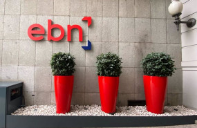 ep archivo   macetas y logo de ebn banco en la entrada de la sede en madrid en el paseo de recoletos