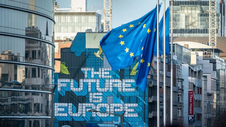 ep 29 january 2020 belgium brussels european flags wave near a mural painting with the inscription